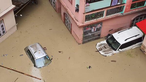 Flash floods kill at least 31 in northeastern India and leave nearly 100 missing